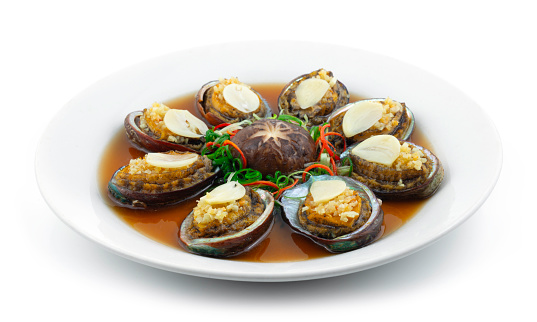 Steamed Abalone with Garlic decoration Mushroom Chinese New year menu Style sideview