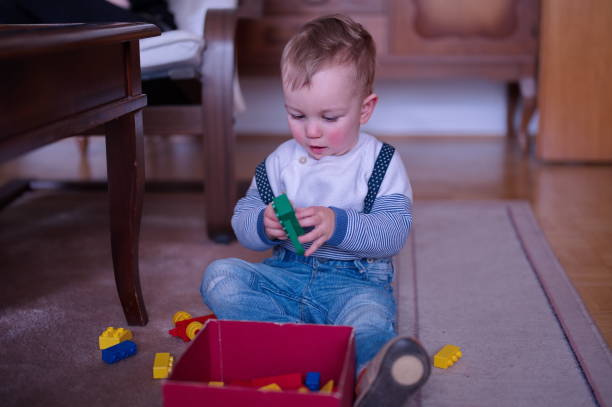 istock Little boy playing on the floor 1524235462