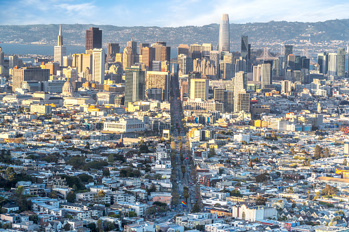 Aerial view of city skyline, calm bay and bridge at sunset, San Francisco