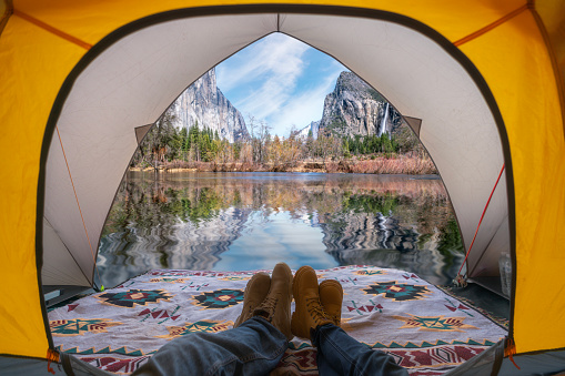 traveller sleep in tent with yosemite national park view, yosemite valley, USA