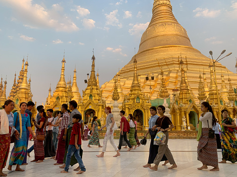 Yangon, Myanmar - March 3, 2020 - Unidentified crowd walk around Shwedagon Pagoda in Myanmar, religious temple.