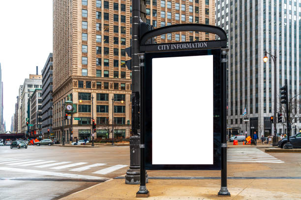 Blank white ad billboard at bus stop for advertising, Chicago city buildings and street background. Copy space