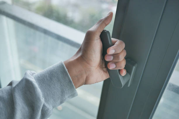 istock hand open gray plastic pvc window at home at early morning 1524276543