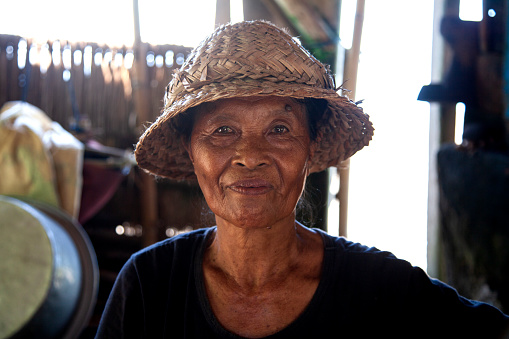 March 15th, 2022 - Goa Lawah, Klungkung, Bali, Indonesia.
A natural salt farmer at Goa Lawah Beach or Pantai Goa Lawah in East Bali, Indonesia, This Balinese woman uses sea water to manufacture natural salt in the sun every day for her living.