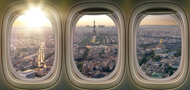 Eiffel tower view and Paris city from windows of airplane stock photo