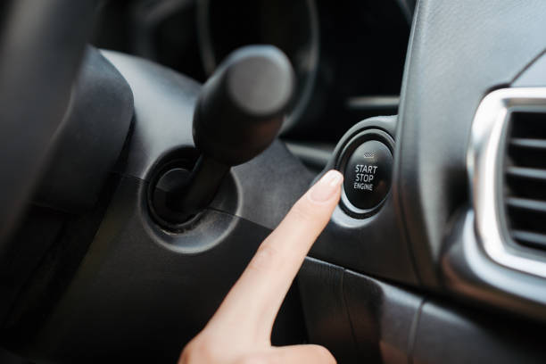 istock Close up of finger pressing engine start button until engine turns on. 1524449740