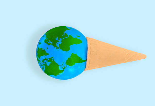 istock Miniature Globe in a Waffle Cone on Blue 1524472315