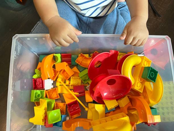 istock Baby boy playing with colorful plastic toy 1524491173