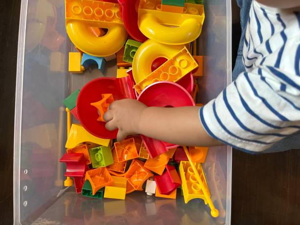 istock Baby boy playing with colorful plastic toy 1524492220