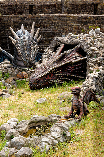 Dragon in the castle ground of Caerphilly Castle, a partially ruined fortification, dating from the 13th Century. Caerphilly Mid-Glamorgan South Wales, United Kingdom - 25th of June 2023