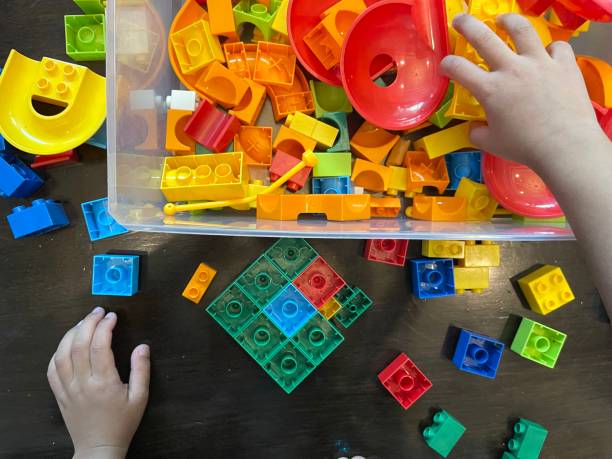 istock Baby boy playing with colorful plastic toy 1524507948