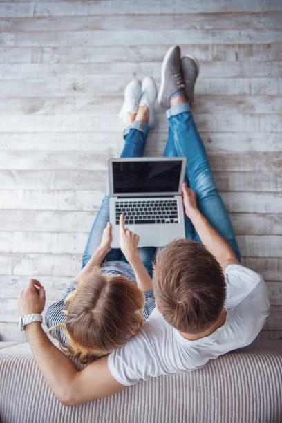 istock Beautiful young couple with gadget 1524521670