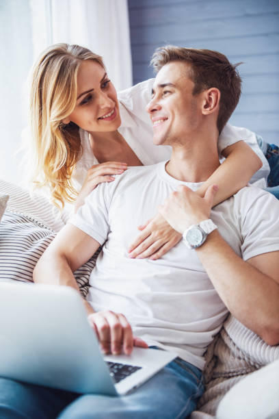 istock Beautiful young couple with gadget 1524523762