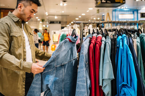istock Crop ethnic man choosing clothes in shop 1524538849