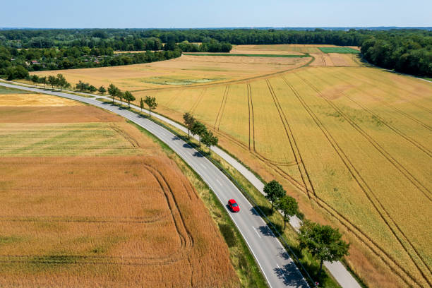 istock Red car on rural road, aerial view 1524555477