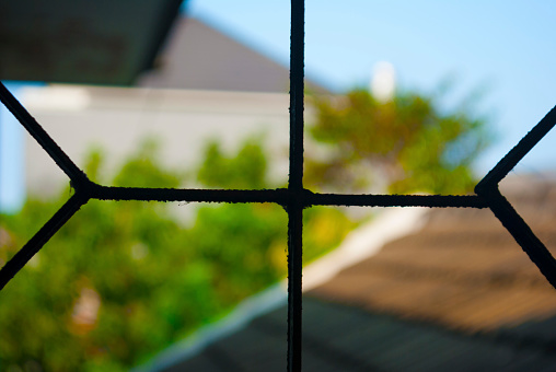 Close up of window frame with blurred background.