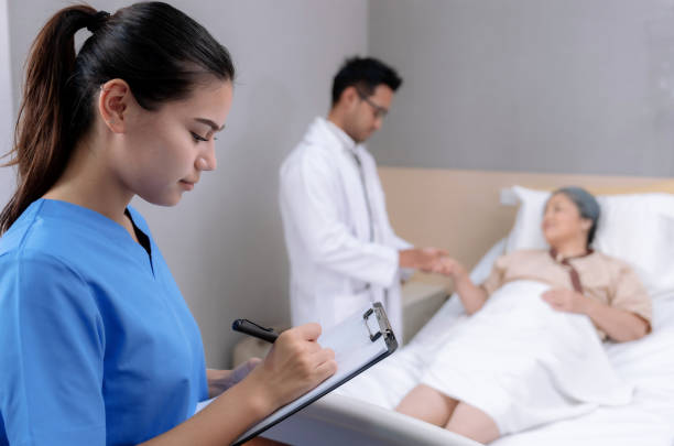 istock Doctors and nurses helping and caring for old people at nursing homes. 1524587350