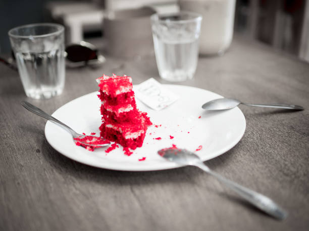 Close-up of a red velvet cake on wooden spoon. Top view