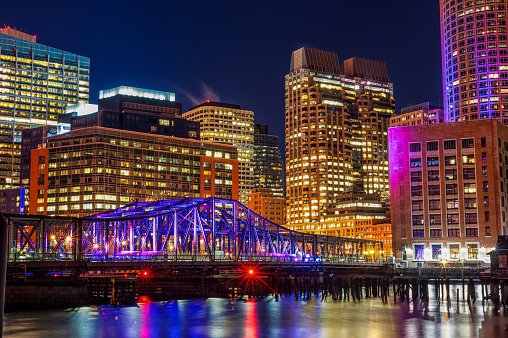 Boston Cityscape with River Bridge. Long Exposure Night Photography. Massachusetts, USA