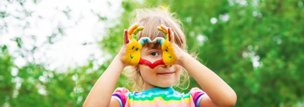 children hands in colors. summer photo. selective focus. - armenian ethnicity imagens e fotografias de stock