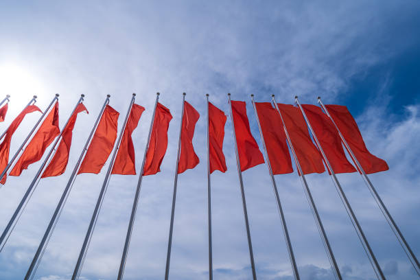 istock a lot many red flags. Red flags in the blue sky with white clouds. 1524757397
