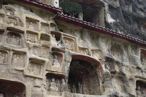 white carved stone fences and columns of a Buddhist monastery