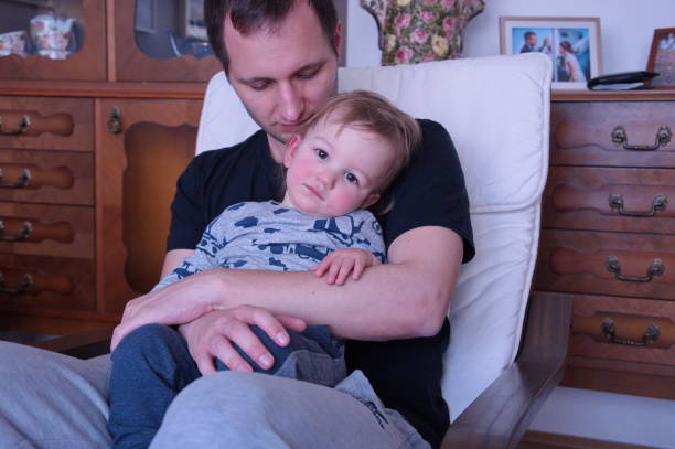 istock Father holding his little boy 1524814860