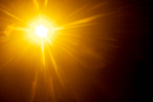 istock Blurred image Sun flare on the black background 1524913630