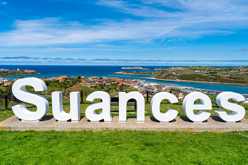 Suances sign letters with aerial skyline view and sea in Cantabria in north Spain