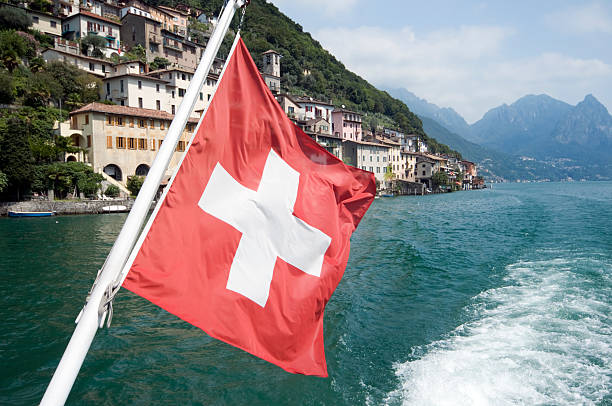 Swiss flag on the stern of a boat on Lake Geneva in Lausanne. Travel concept