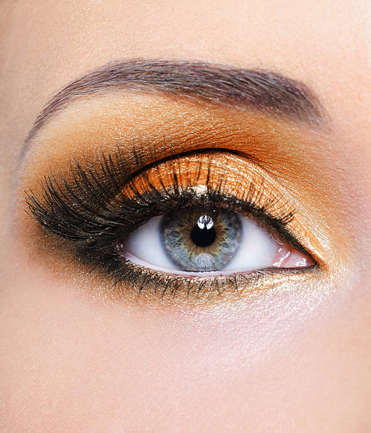 istock Woman eye with orange make-up 152493653