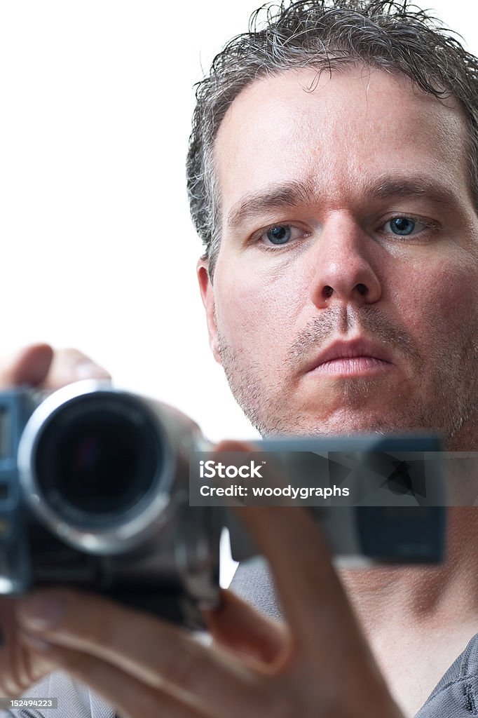 Homem fotografando com uma câmera de vídeo - Foto de stock de 30-34 Anos royalty-free