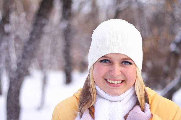 Young Caucasian girl enjoying the cool winter day with cozy warm clothing.