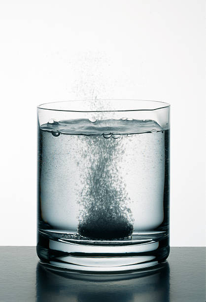 istock Soluble tablet dissolving in a clear glass tumbler 152495635