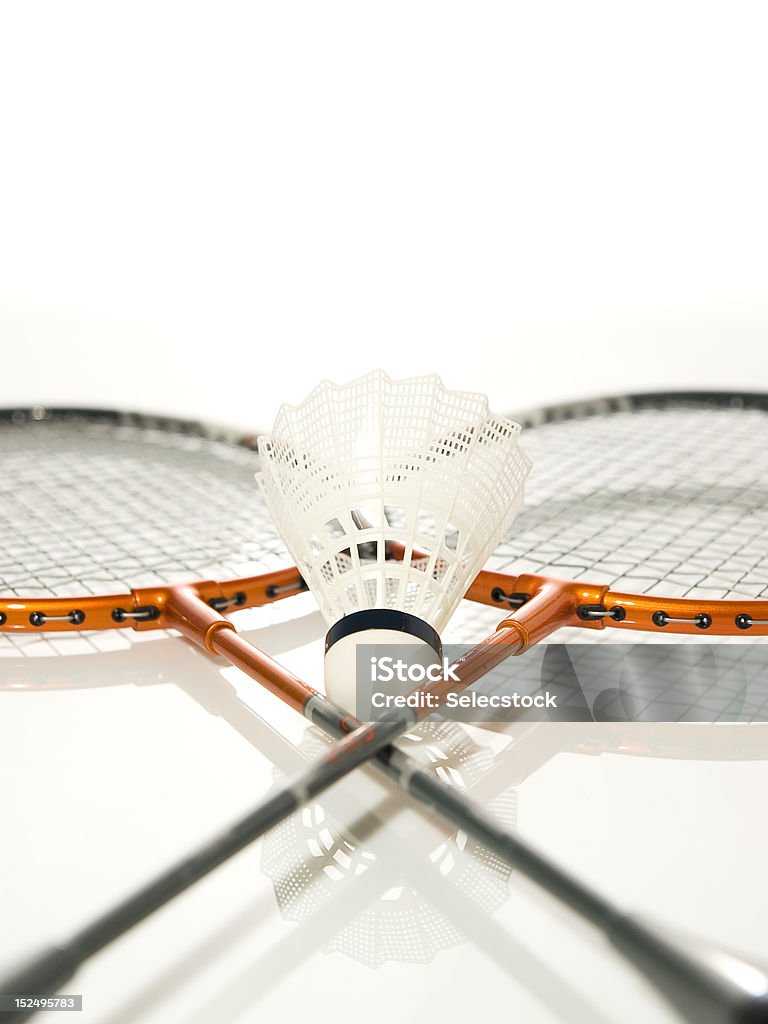 Rackets Two rackets crossed and White shuttlecock of badminton Badminton - Sport Stock Photo