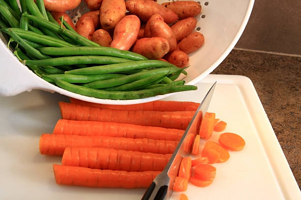 Chopping Fresh Raw Vegetables stock photo