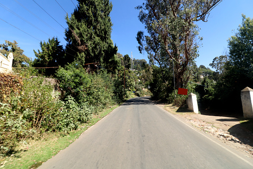 Road trip by car in mountain range Ooty, Tamil Nadu, India. View inside from the car.