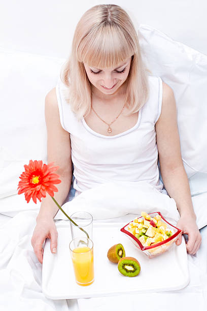 istock Cute girl has a breakfast in the bed 152496571