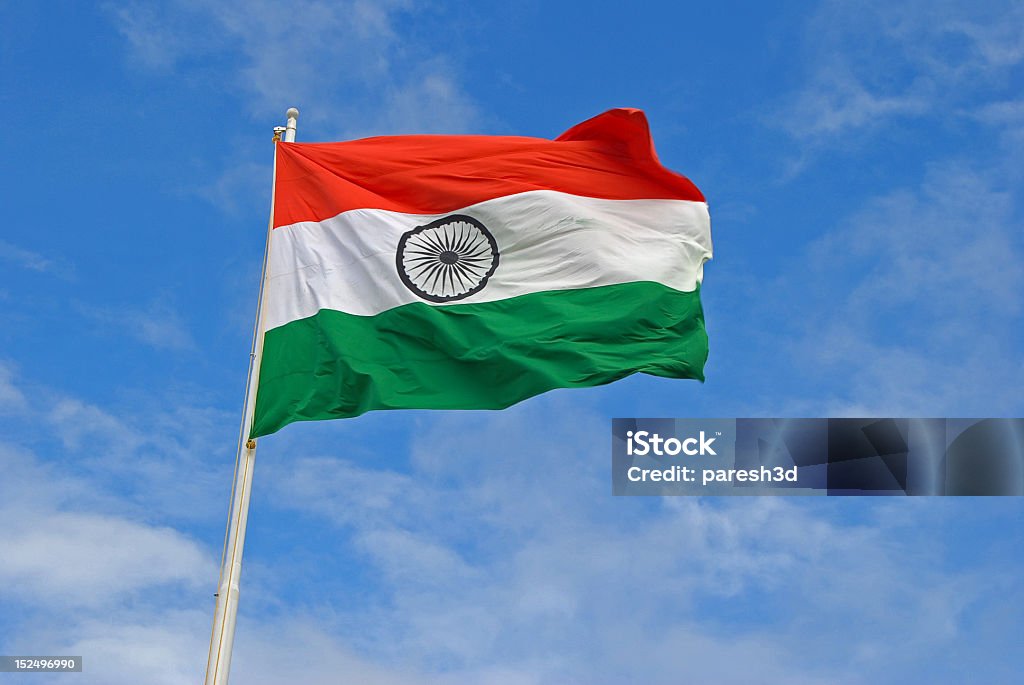 The Indian Flag Flying High On Top Of A Flag Pole Stock Photo - Download  Image Now - Indian Flag, Flag, Sky - iStock