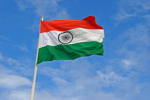 The Indian Flag Flying High On Top Of A Flag Pole Stock Photo - Download  Image Now - Indian Flag, Flag, Sky - iStock