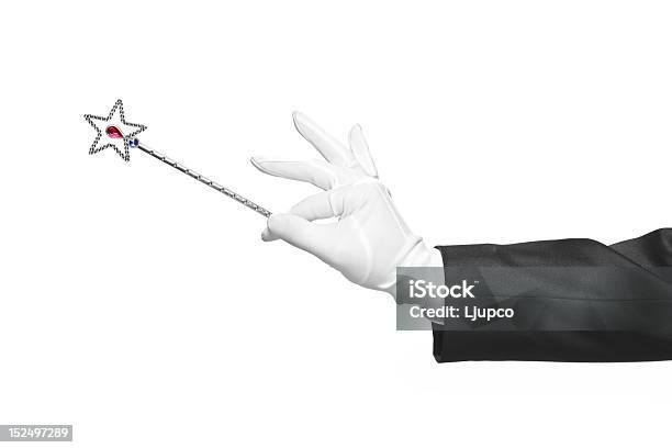 Holding A Magic Wand Stock Photo - Download Image Now - Magic Wand, Magician, Stick - Plant Part