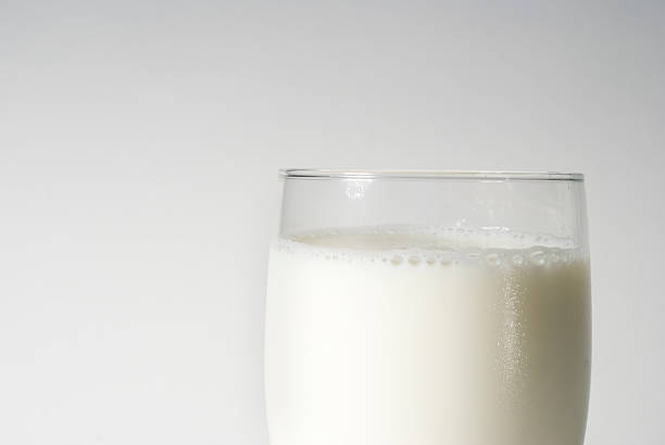 closeup glass of milk stock photo