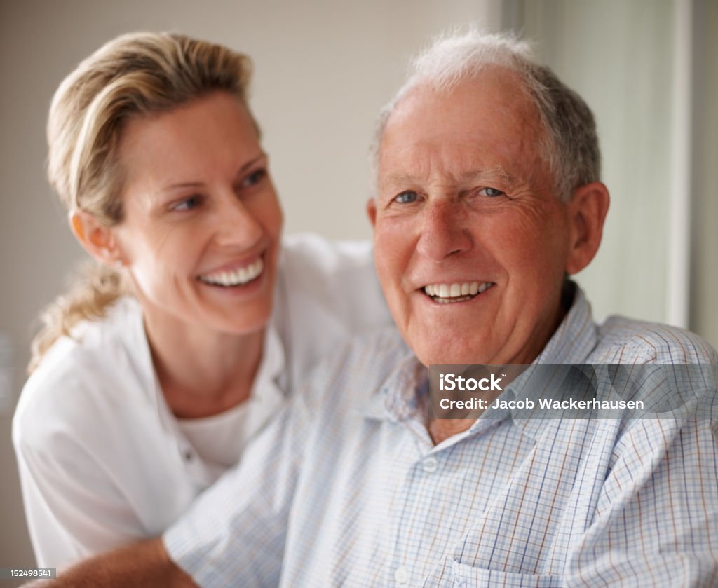 Elderly man on wheelchair with a nurse Senior Adult Stock Photo