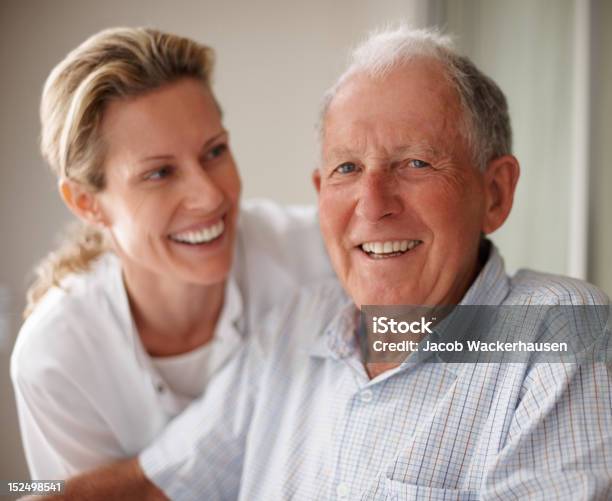 Elderly Man On Wheelchair With A Nurse Stock Photo - Download Image Now - Senior Adult, Community Outreach, Senior Men