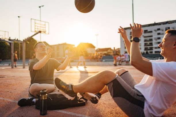 istock Cheerful man with a chromosomal disorder called Down syndrome enjoys spending time with a friend 1524986619