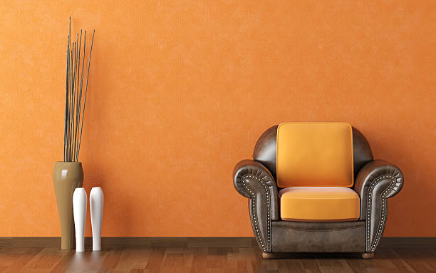 istock interior design orange wall and brown couch 152498679