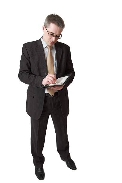 istock businessman makes entry in daily log 152498817