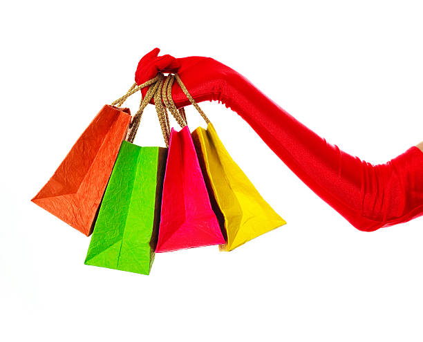 istock hand with four shoppign bags 152498857