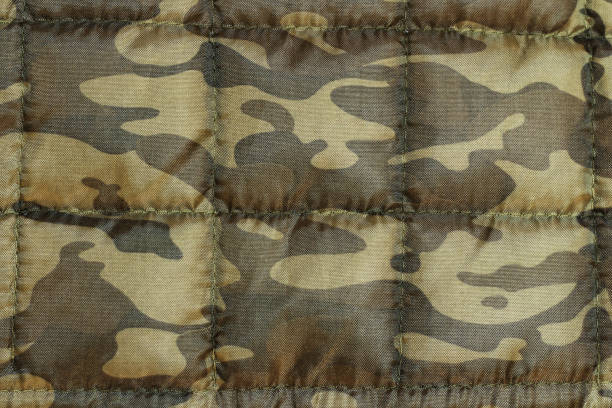 istock Camouflage background texture, Close up of military uniform surface 1524989088