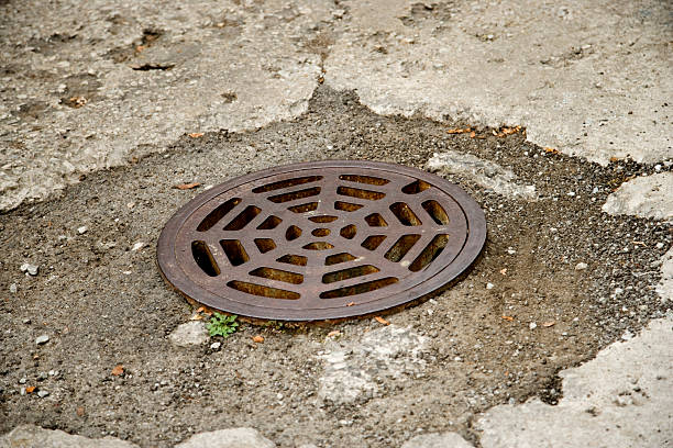 istock Round Storm Drain in the road 152499140